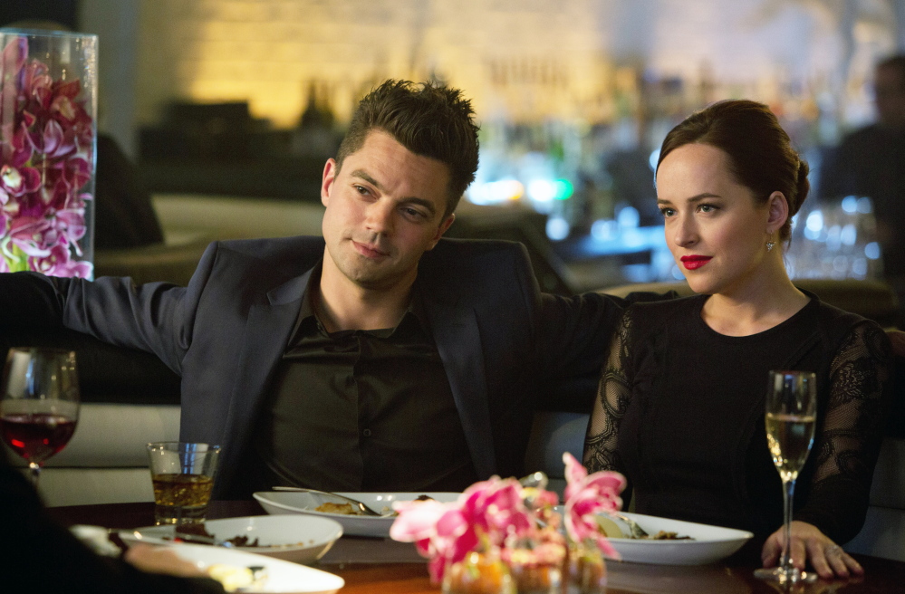Dominic Cooper, left, and Dakota Johnson in a slower-paced scene from “Need for Speed.”
