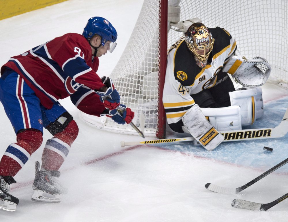 Goalie Tuukka Rask of the Boston Bruins guards the post and prevents a wrap-around shot by Lars Eller of the Montreal Canadiens from getting past him during the first period of the Bruins’ 4-1 victory on the road Wednesday night. Boston will be home Thursday night against Phoenix.