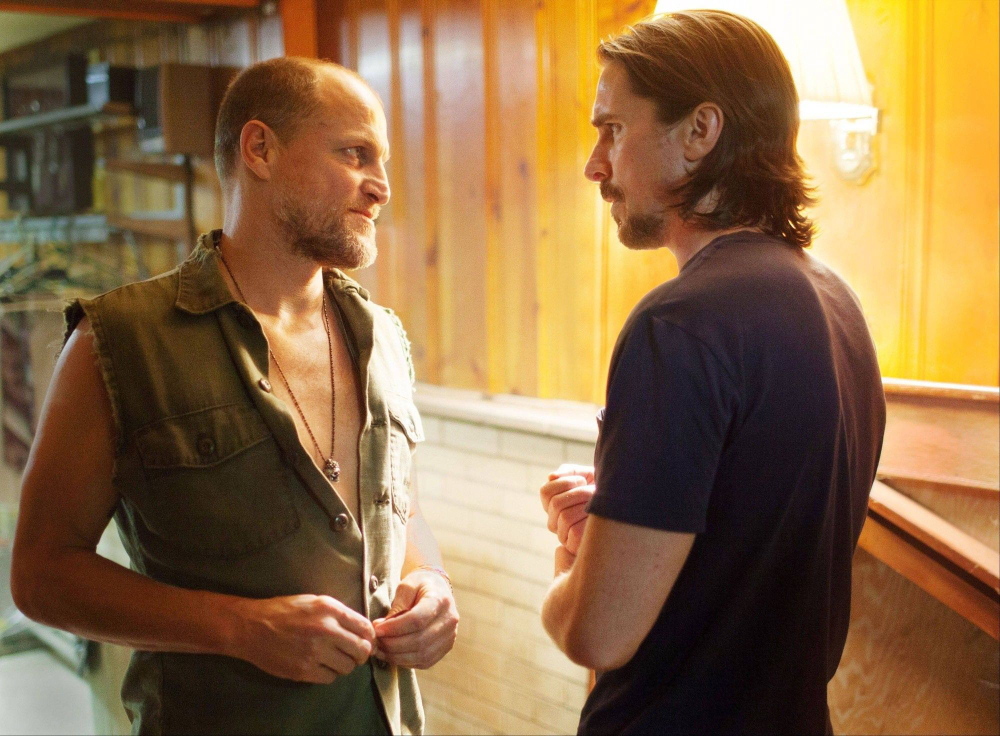 Woody Harrelson, left, and Christian Bale in “Out of the Furnace,” new to DVD.