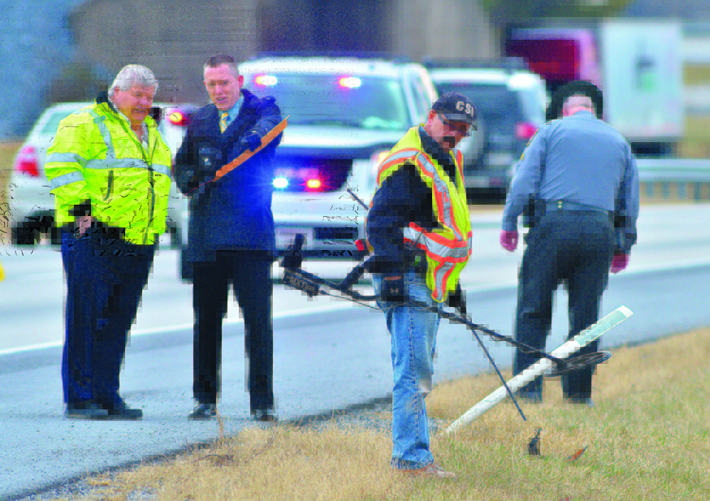 Franklin County coroner’s office staffers and Pennsylvania State Police search Jan. 15 for evidence along Interstate 81 at Exit 3, where a shooting occurred Jan. 4. Timothy “Asti” Davison of Poland, Maine, died after being shot multiple times after his vehicle was run off the road.