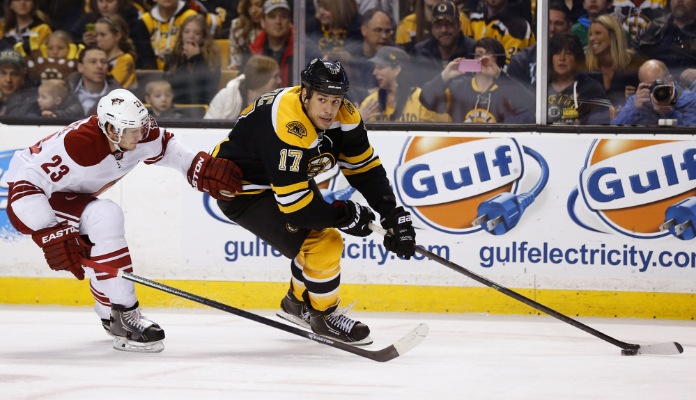 Boston Bruins’ Milan Lucic looks for an opening around Phoenix Coyotes defenseman Oliver Ekman-Larsson in the second period Thursday.