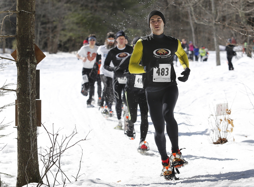 Cumberland’s Andy Kiburis leads a pack of runners during last Sunday’s Bradbury Blizzard snowshoe race, a rugged 5-mile trek at Pownal’s Bradbury Mountain. Kiburis finished in 38 minutes, 27 seconds, tops among the 52 finishers.