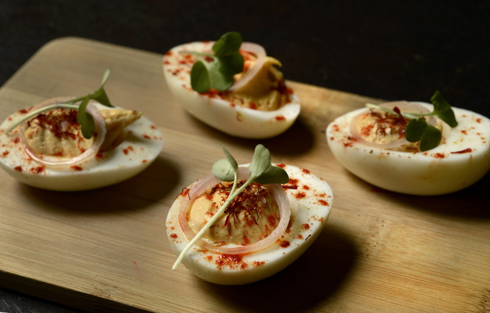 The list of appetizers at Gather includes deviled eggs with saffron and paprika.