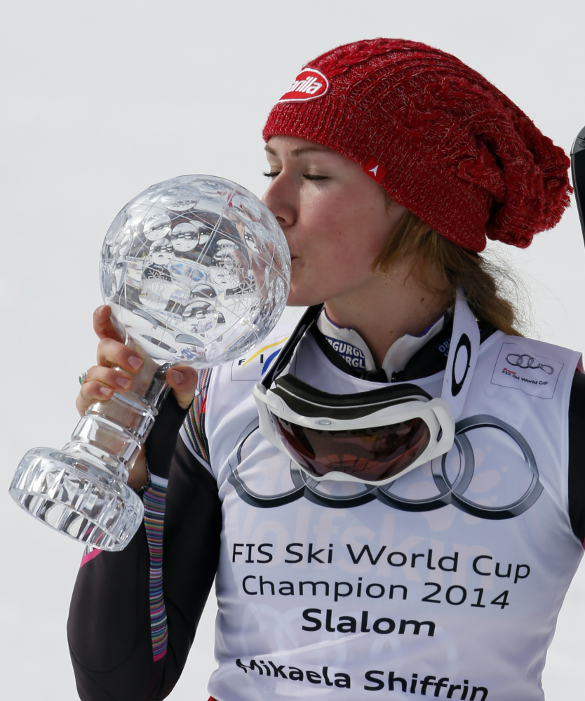 Mikaela Shiffrin of the United States kisses her trophy after winning an Alpine Ski women’s slalom at the World Cup finals, in Lenzerheide, Switzerland, on Saturday.