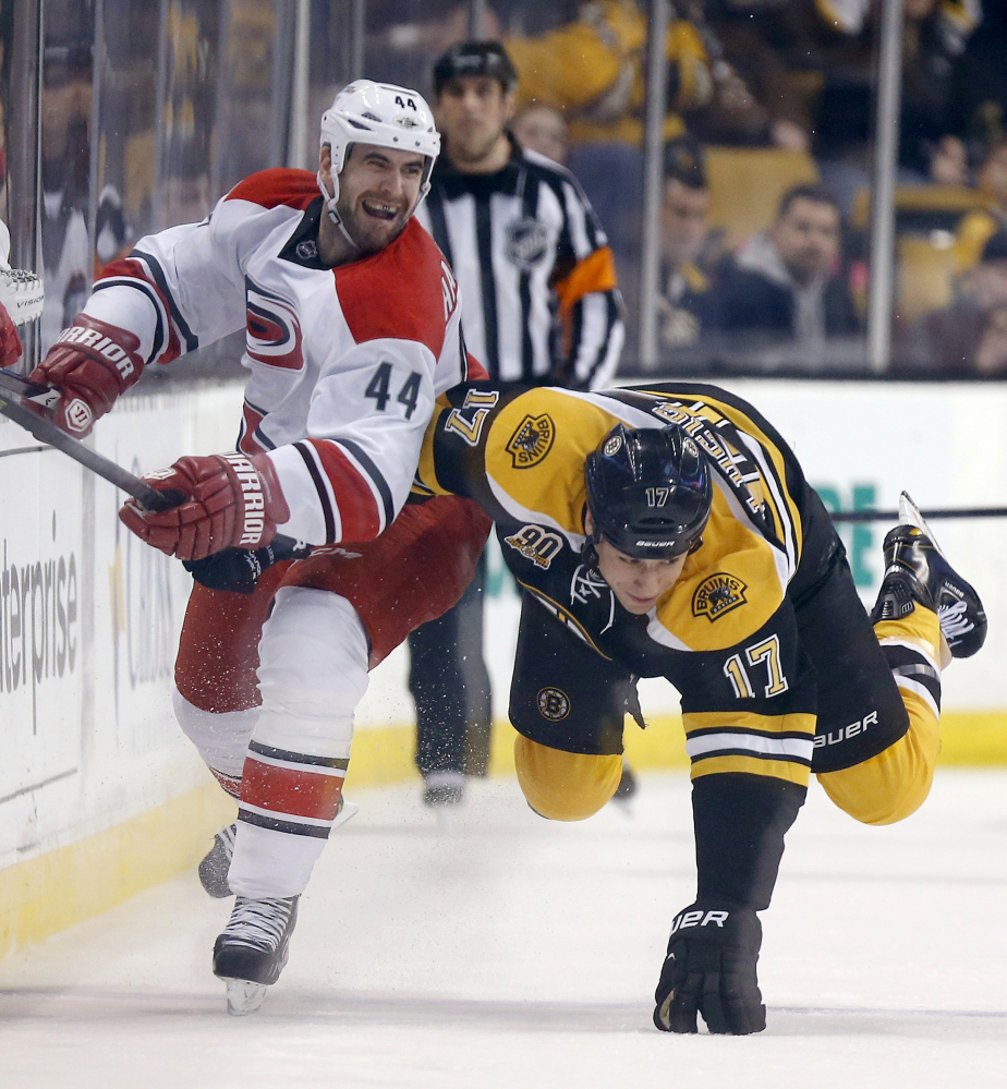 Jay Harrison of the Carolina Hurricanes may have sent Milan Lucic of the Boston Bruins sprawling in the first period Saturday, but it was the Bruins who won their eighth straight and sent Carolina sprawling to its eighth loss in 11 games, 5-1.