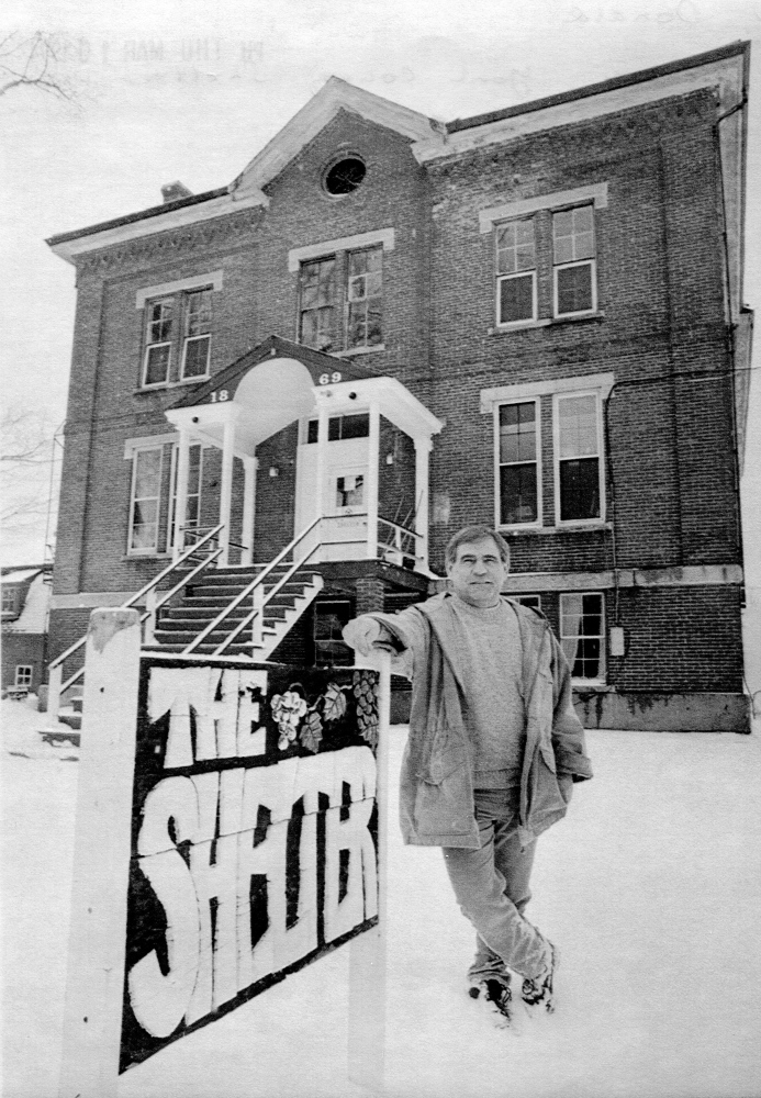 Don Gean stands in front of the original homeless shelter in Alfred for this photo in 1994. The shelter was housed in the former jail before being moved into a more comfortable building that year.