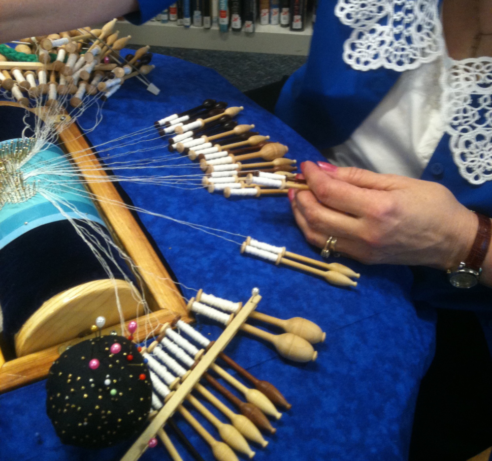 At the Scarborough Public Library’s 2013 Textile Day, an artisan demonstrates how to create bobbin lace.