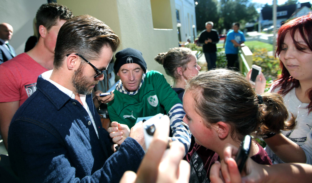 Actor Chris Pine signs an autograph outside the courthouse in Ashburton, New Zealand, on Monday after pleading guilty to a drunken driving charge.