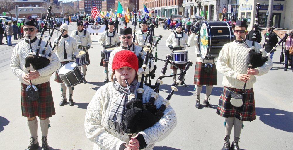 The Claddah Mohr Pipe Band fills Commercial Street with music during the St. Patrick’s Day parade in Portland on Sunday.