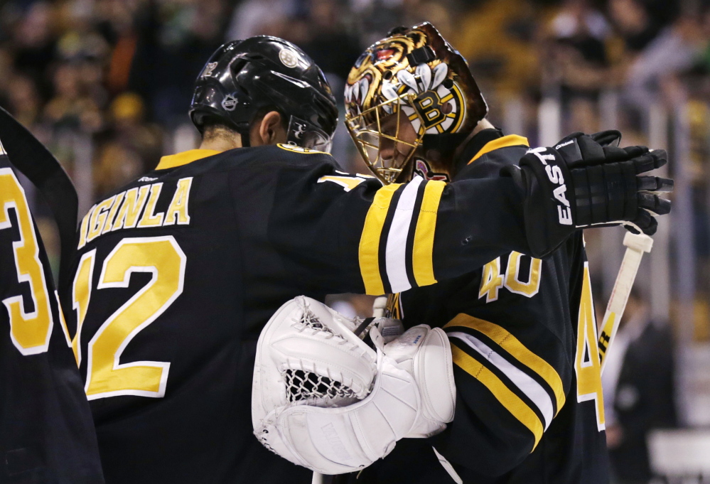 Boston Bruins goalie Tuukka Rask (40) is congratulated by Boston Bruins right wing Jarome Iginla after defeating the Minnesota Wild 4-1 in an NHL hockey game, Monday, March 17, 2014, in Boston. Iginla had two goals and Rask made 33 saves in the Bruins win. (AP Photo/Charles Krupa) Boston Bruins goalie Tuukka Rask (40) is congratulated by Boston Bruins right wing Jarome Iginla after defeating the Minnesota Wild 4-1 in an NHL hockey game, Monday, March 17, 2014, in Boston. Iginla had two goals and Rask made 33 saves in the Bruins win. (AP Photo/Charles Krupa)