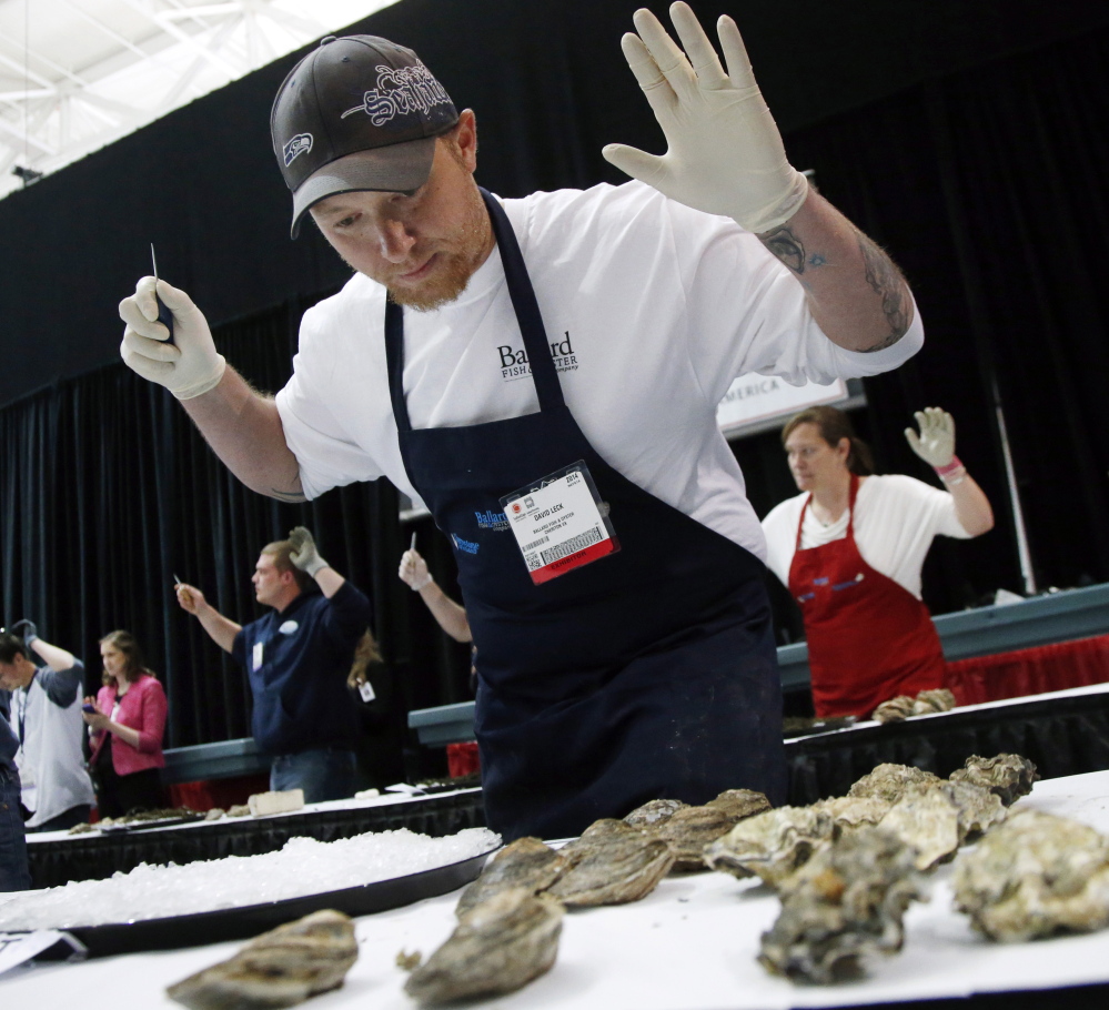 David Leck, of Ballard Fish & Oyster of Cheriton, Va., gets set for an oyster shucking competition at the 33rd Seafood Expo North America trade show in Boston on Monday.