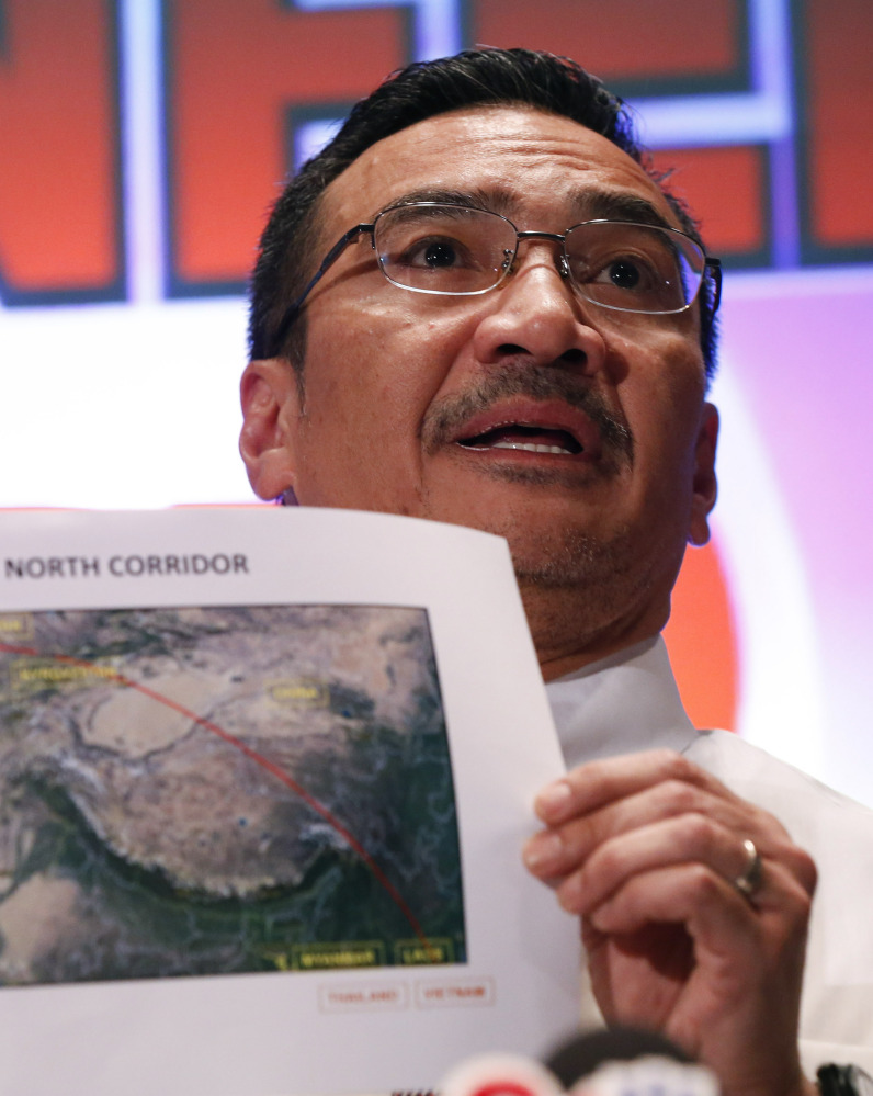 Malaysia’s acting Transport Minister Hishamuddin Hussein shows maps of northern search corridor on Monday in Sepang, Malaysia.
