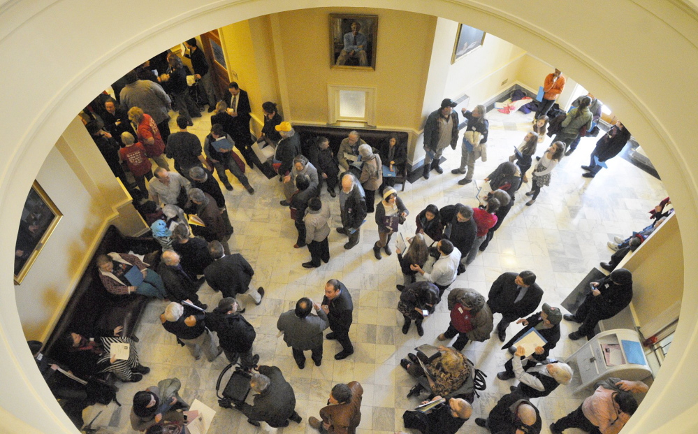 The third floor hallway between Maine's House and Senate chambers is crowded with people attending a rally to support Medicaid expansion on Jan. 8, the first day of this year's legislative session.