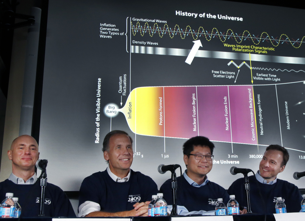 Scientists, from left, Clem Pryke, Jamie Bock, Chao-Lin Kuo and John Kovac hold a news conference at the Harvard-Smithsonian Center for Astrophysics in Cambridge, Mass., on Monday regarding their new findings on the early expansion of the universe.