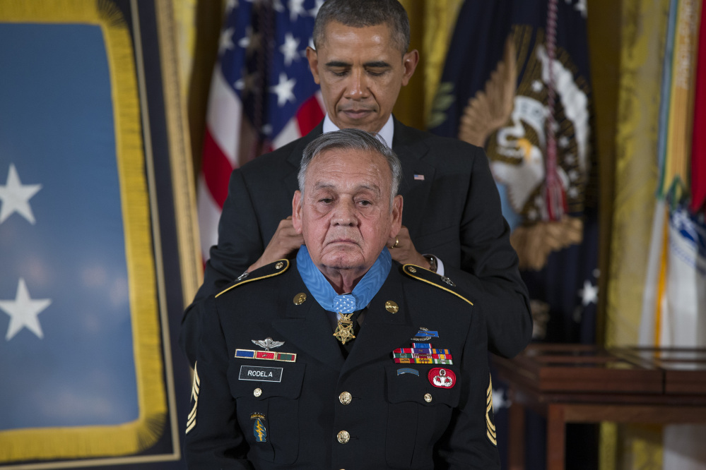 Sgt. First Class Jose Rodela is awarded the Medal of Honor by President Obama during a ceremony at the White House on Tuesday.
