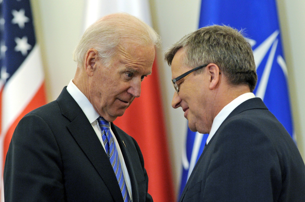 U.S. Vice President Joe Biden and Polish President Bronislaw Komorowski talk after a press conference in Warsaw, Poland, Tuesday. Biden arrived in Warsaw for consultations with Komorowski and Prime Minister Donald Tusk a few hours after Russian President Vladimir Putin approved a draft bill for the annexation of Crimea, one of a flurry of steps to formally take over the Black Sea peninsula.