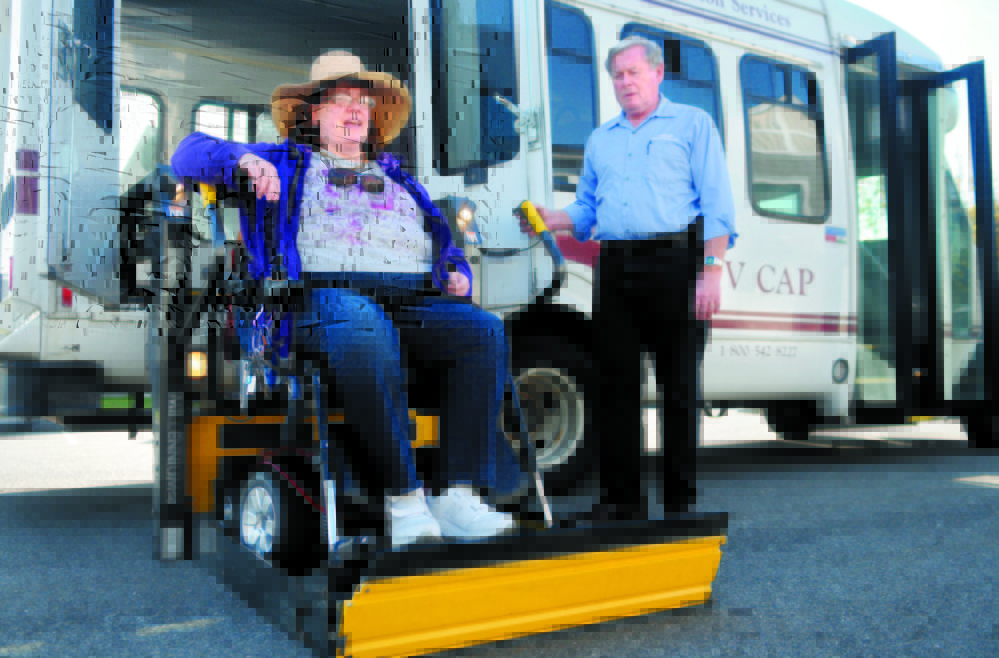 Cindy Dow is lifted into a Kennebec Explorer bus last fall for a ride from her Augusta home to an appointment. Rides arranged by Coordinated Transportation Solutions often fail to show up or are late, Dow and others have said. State officials haven’t explained why CTS was paid an extra $1.2 million in February.