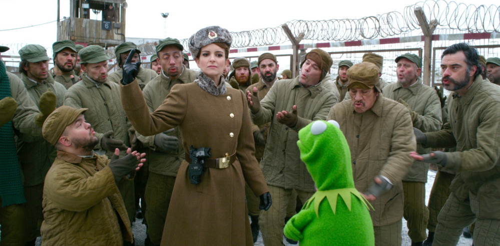 Tina Fey with Kermit in “Muppets Most Wanted.”