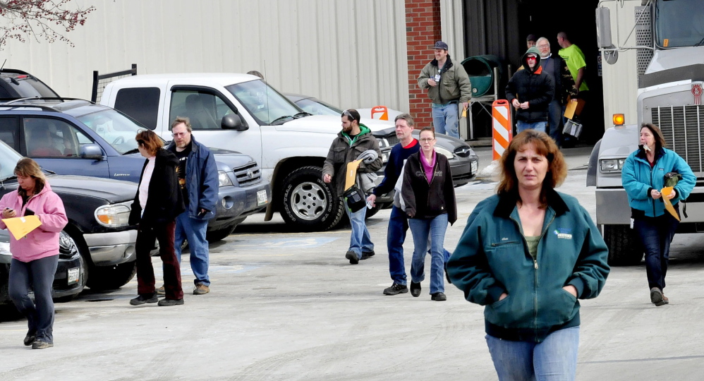 Employees leave United Technologies Corp. Fire & Security company in Pittsfield on Wednesday. The company announced Tuesday it will close in a year. Employees interviewed Wednesday said that they did not see the announcement coming and the mood of workers was subdued.