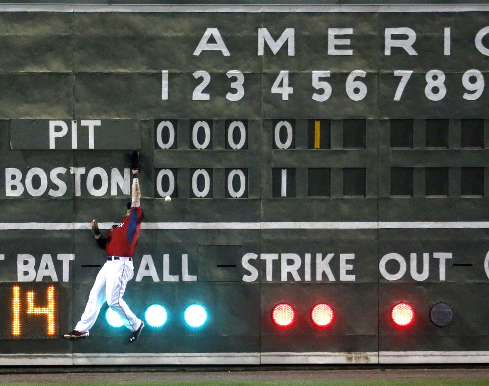 It was a crash landing Wednesday night for Jonny Gomes of the Boston Red Sox, who made contact with the left-field scoreboard at Fort Myers, Fla. – the one that looks just like the one in Fenway Park – in an attempt to catch a fly ball.