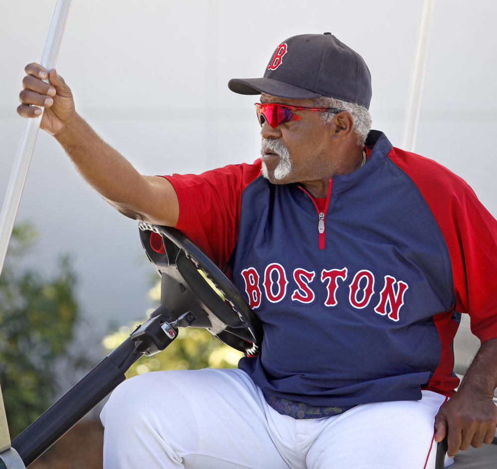 Shades of 1975 and that look-everywhere-but-the-plate delivery. Yes, that’s Luis Tiant in spring training, riding around in a golf cart, and so likely wishing he could have had one more start against the Big Red Machine in another epic World Series game.