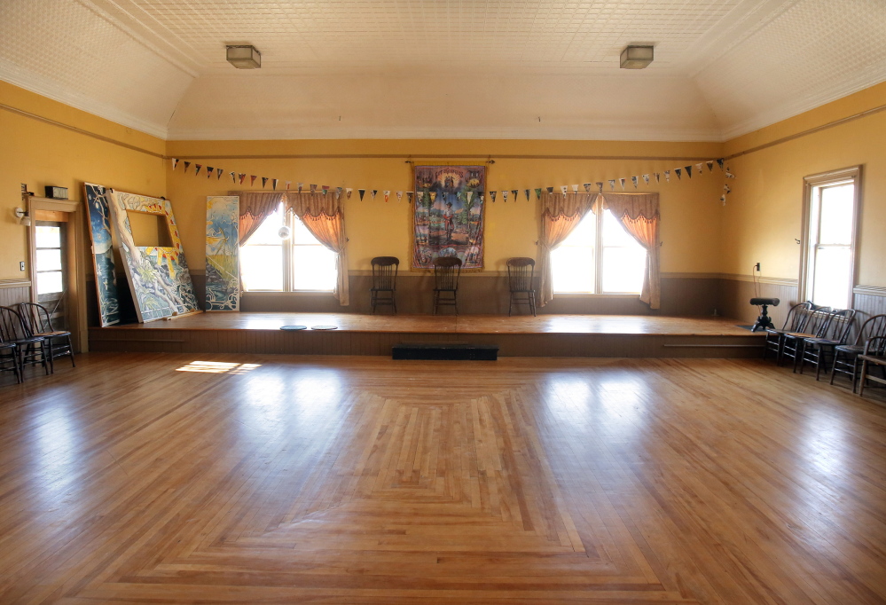 The Beehive Collective purchased the Machias Valley Grange Hall in 2001 and restored it with volunteers and using money raised through its art projects. It owns the building and pays the taxes on it but has turned it back over to the Grange and the community for public gatherings, including dances held on the second floor of the Grange, pictured here.