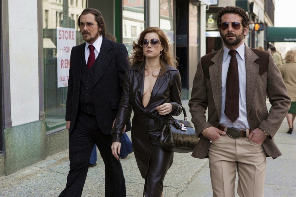 Christian Bale, Amy Adams and Bradley Cooper in “American Hustle.”
