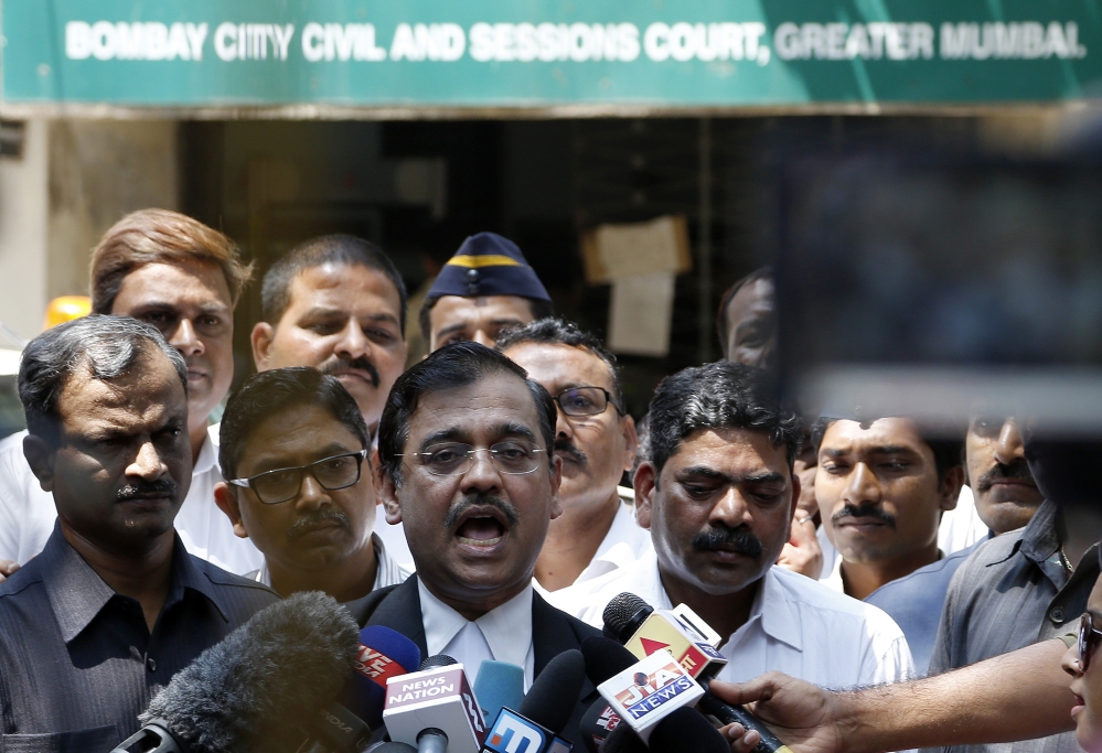Special Public Prosecutor Ujjwal Nikam speaks to the media outside court Thursday after the court convicted four men of raping a photojournalist and a call-center operator last summer inside an abandoned textile mill in the financial hub of Mumbai, India.