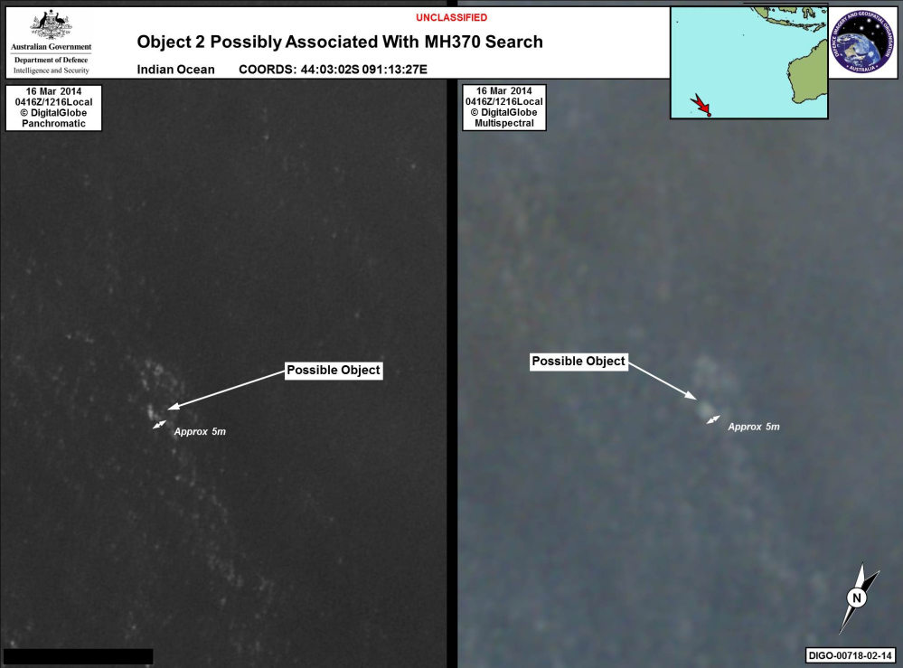 In this satellite imagery provided by Commonwealth of Australia – Department of Defence on Thursday, a floating object is seen at sea next to the descriptor which was added by the source. Australia’s government reported Thursday that the images show suspected debris from the missing Malaysia Airlines jetliner floating in an area 1,550 miles southwest of Perth, Australia.