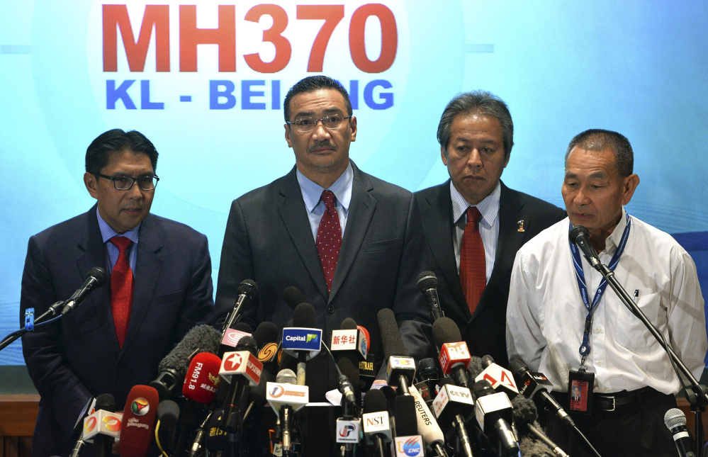 From left, Malaysia’s Department of Civil Aviation director general Azharuddin Abdul Rahman, Malaysian acting Transport Minister Hishammuddin Hussein, Malaysian Foreign Minister Anifah Aman and Malaysia Airlines Group Chief Executive Ahmad Jauhari Yahya attend a news conference at a hotel in Sepang, Malaysia, on Thursday.