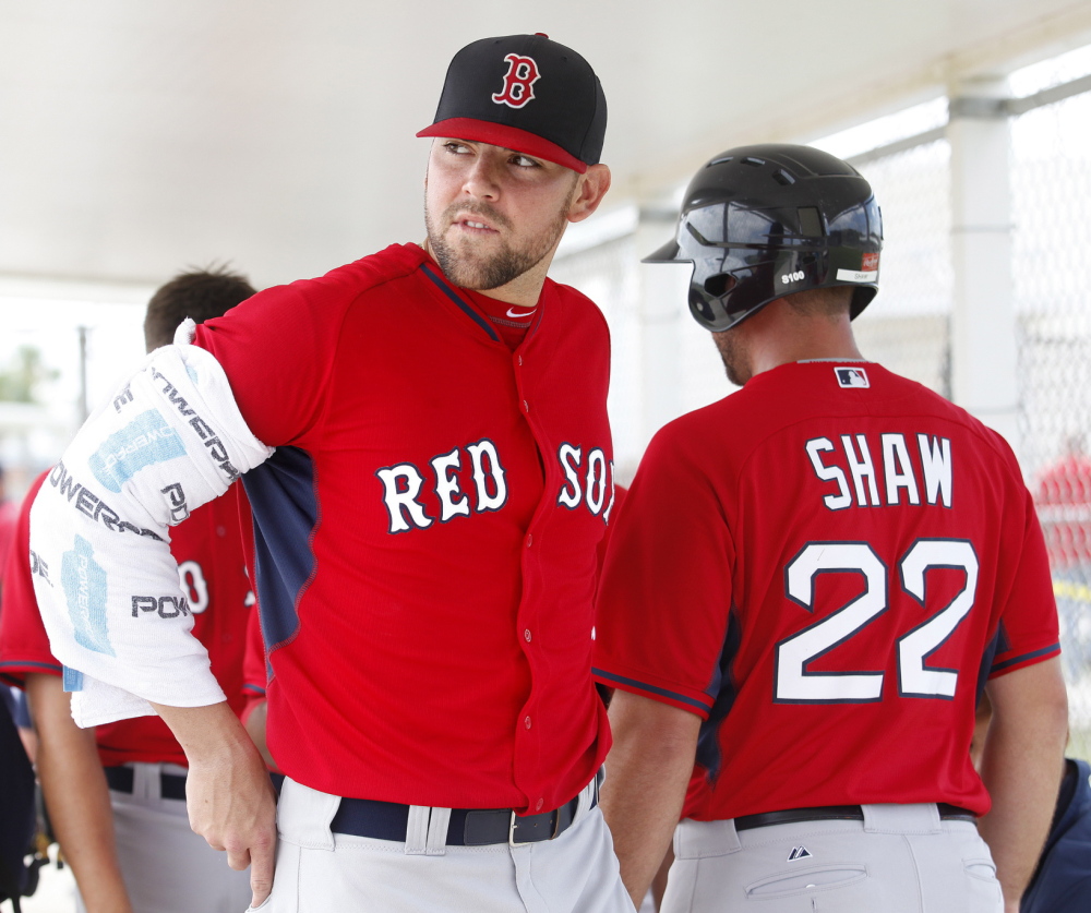 Pitcher Anthony Ranaudo, left, his arm iced, is thought to be catching up with his potential. While he’ll probably start the season in Pawtucket, Boston might come calling.