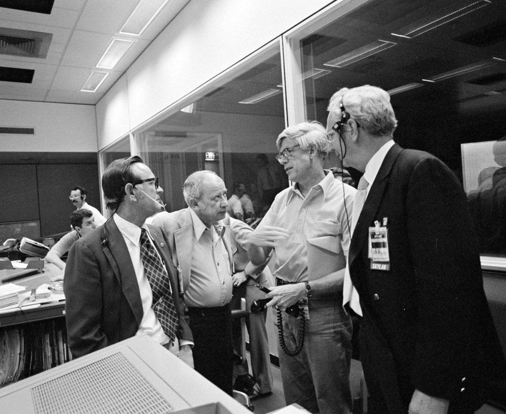 Jack Kinzler, second from right, seen in June 1973 with other NASA officials in Houston, was known as “Mr. Fix-it” in the agency for his ability to find solutions to unexpected problems. He died March 4 at 94.