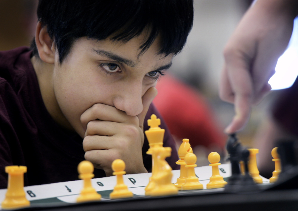 Roman Medina, a sophomore at Cape Elizabeth, carefully watches his opponent’s next move during a chess game while practicing with the Cape Elizabeth chess team Monday.