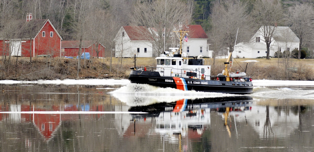 In this 2012 file photo, a Coast Guard ice cutter cruises up the Kennebec River past the Moulton Farm in Pittston. This year, the cutters will find a lot more ice.