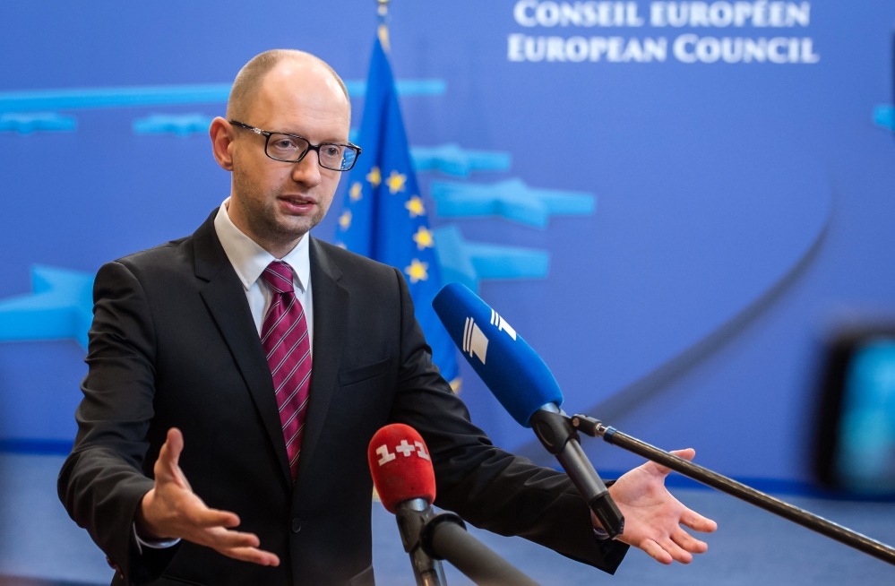 Ukrainian Prime Minister Arseniy Yatsenyuk speaks with the media after a signing ceremony at an EU summit in Brussels on Friday, March 21, 2014. Ukraine’s prime minister has pulled his nation closer into Europe’s orbit, signing a political association agreement with the EU at a summit of the bloc’s leaders. Friday’s agreement between Prime Minister Arseniy Yatsenyuk and the EU leaders was part of the pact that former President Viktor Yanukovych backed out of last November in favor of a $15 billion bailout from Russia. That decision sparked the protests that ultimately led to his downfall and flight last month, setting off one of Europe’s worst political crises since the Cold War.