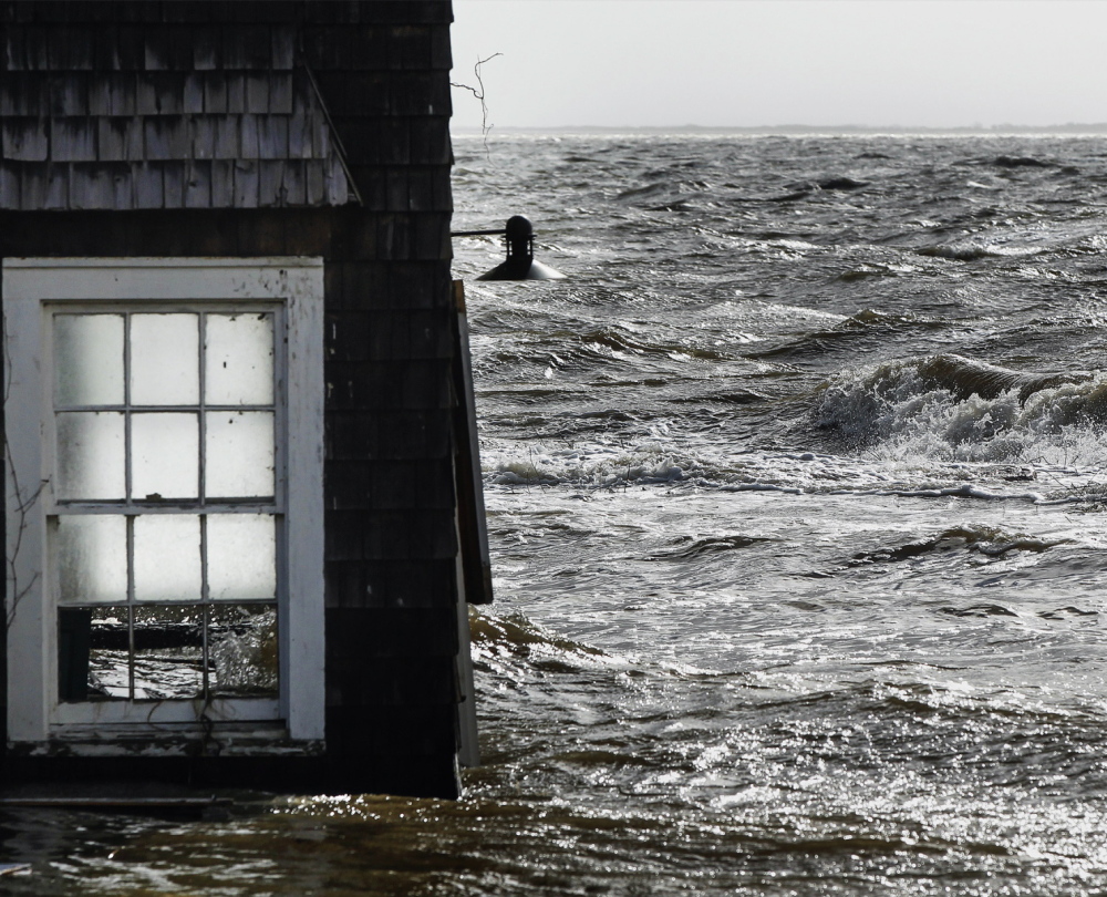 Homes like this one in Bellport, N.Y., caught in flooding from Hurriane Sandy in 2012, may now be sold without new owners facing sharply higher flood insurance premiums.