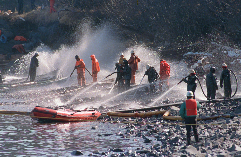 Crews use high-pressure hoses to blast the oil-covered rocks on a beachfront of Naked Island, Alaska, in April 1989. Nearly 25 years after the Exxon Valdez oil spill off the coast of Alaska, some effects linger in Prince William Sound.