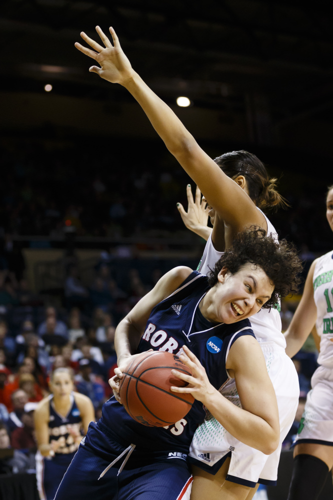Robert Morris forward Artemis Spanou, left, dribbles around Notre Dame forward Taya Reimer during the second half in a first-round game in the NCAA women’s college basketball tournament, Saturday, in Toledo, Ohio.