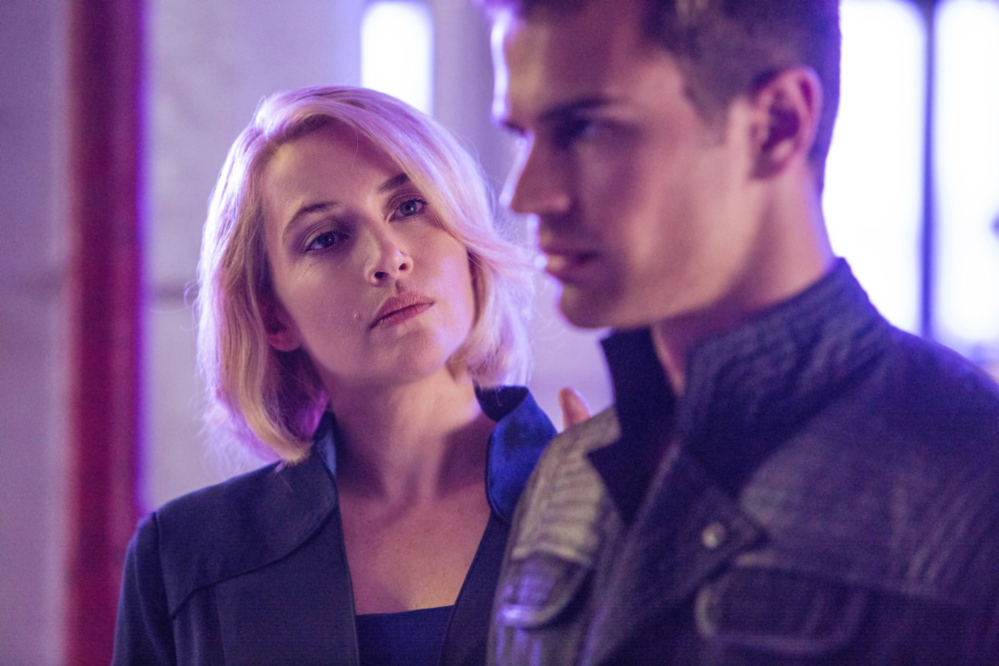Theo James with Kate Winslet, who plays the leader of the “Erudite” faction, which prizes knowledge, in “Divergent,” set in a futuristic Chicago.