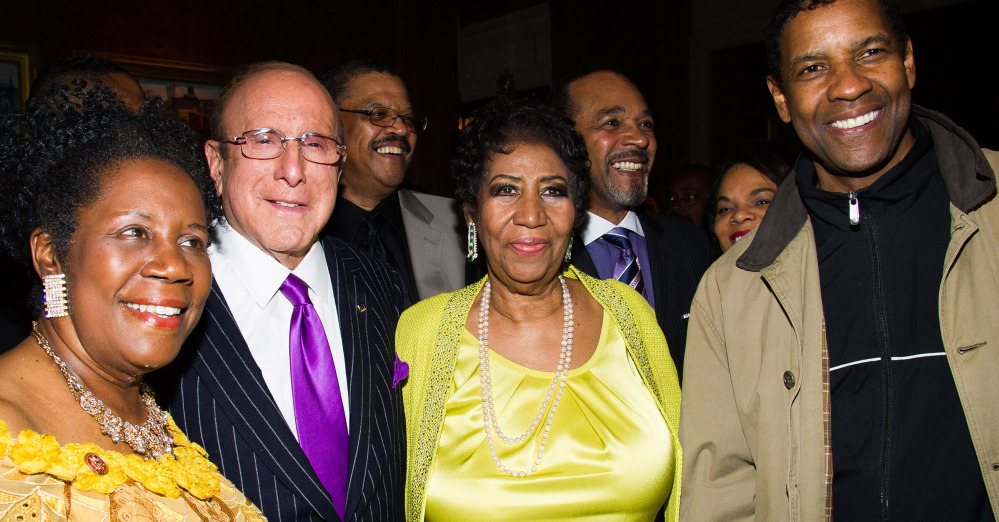 Helping Aretha Franklin, center, celebrate her 72nd birthday in New York were, from left, Rep. Sheila Jackson Lee, Clive Davis and Denzel Washington.