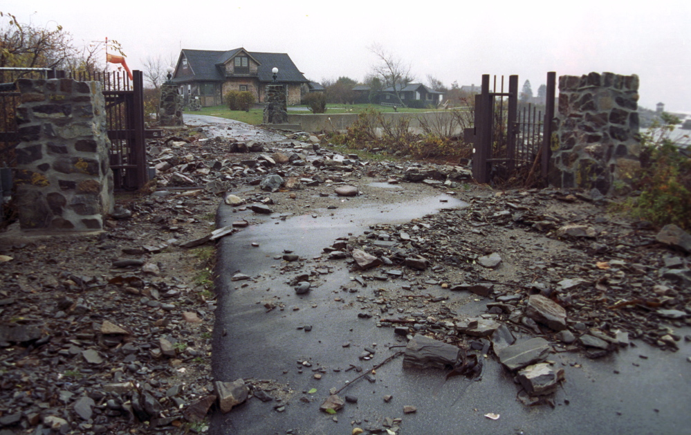 The entrance to the Bush compound on Walker’s Point in Kennebunkport is shown after a severe storm in 1991. Federal subsidized flood insurance covers old homes like the Bushes’, built before there were rules about building close to water.
