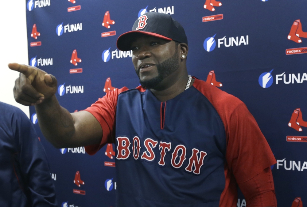 Boston Red Sox designated hitter David Ortiz gestures during a news conference regarding an agreement reached with the team that all but assures the popular slugger will finish his career in Boston, Monday.