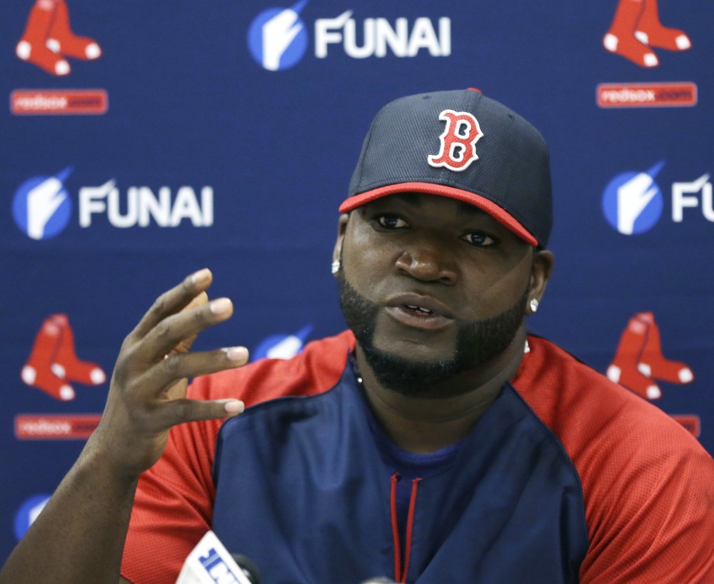 Boston slugger David Ortiz talks to the media Monday in Sarasota, Fla., after signing a new contract with the team.