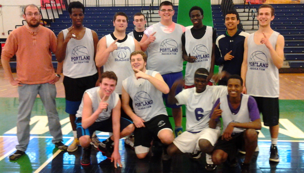 Riverton Rec successfully defended its Greater Portland High School Rec Basketball League championship on March 12 at the Portland Expo. Team members, from left to right: Front row – Ben Peterson, Mike Thurston, Eddy Koma and Ismail Abdi; Back row – Coach Jason Bradley, Jamal Ali, Adam Amabile, Allen Seyler, Drew Waterhouse, David Matthew, King Cua and Caleb Angell.