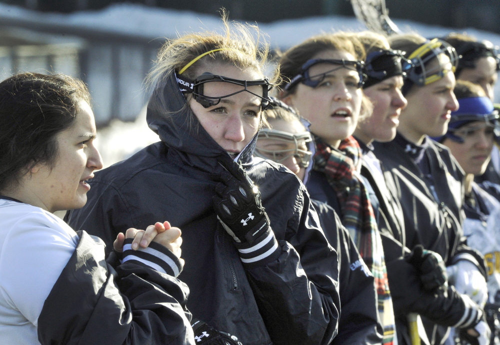They play for the love of the game. Something to remind themselves Tuesday as the University of Southern Maine withstood the cold to win its women’s lacrosse home opener. Kim Vogel, left, and Kaelyn Kuni, second left, were among those trying to avoid frostbite.