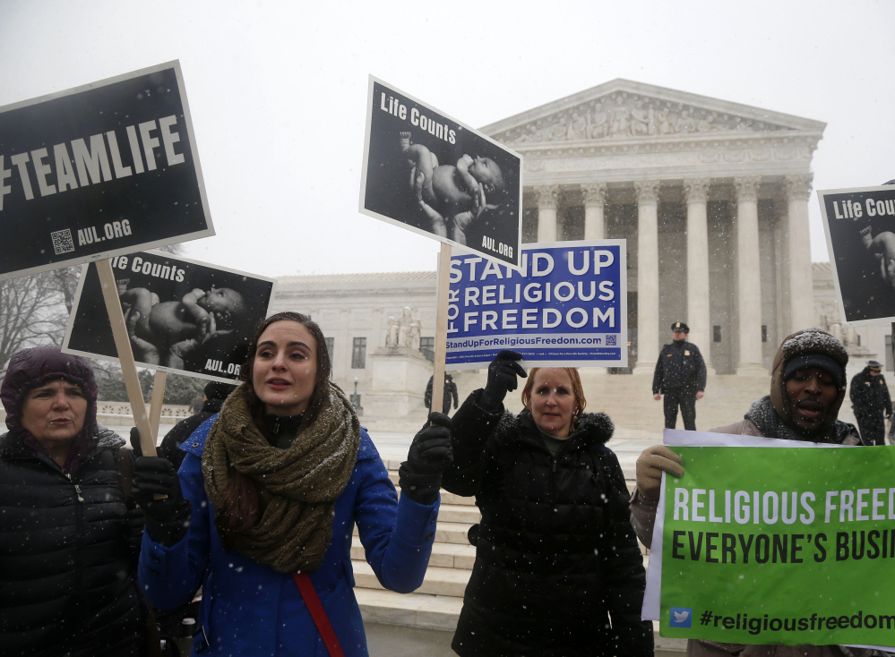 Demonstrators, above and below, rally in front of the Supreme Court in Washington on Tuesday expressing opposite views on the Affordable Care Act requirement that businesses provide female employees with health insurance that includes access to contraceptives.