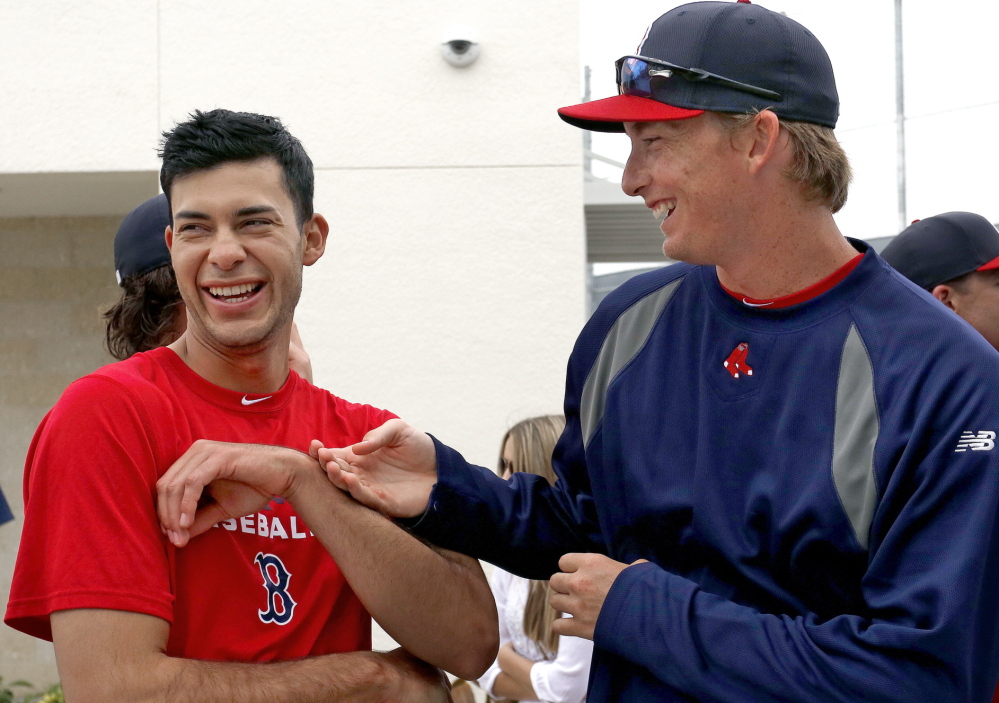 Opposites attract, and for Noe Ramirez, left, and Henry Owens, who are both expected to pitch for the Portland Sea Dogs this season, the attraction has made them close friends as they push for spots with the Boston Red Sox.