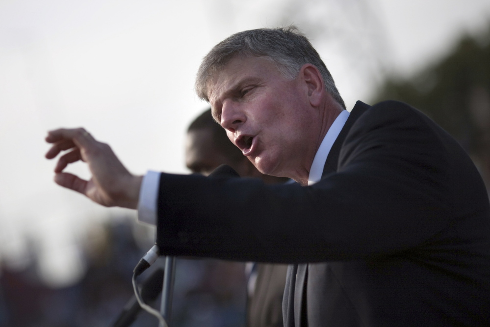 Franklin Graham, son of evangelist Billy Graham, addresses the crowd at the Festival of Hope, an evangelistic rally at the national stadium in Port-au-Prince, Haiti, in 2011.