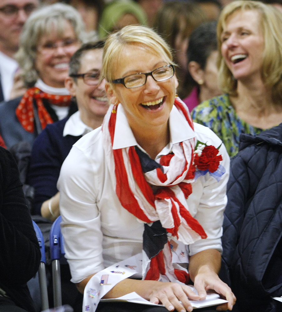 Ilze Apine of Freeport, originally from Latvia, smiles during the naturalization ceremony at the Middle School of the Kennebunks in Kennebunk on Friday.