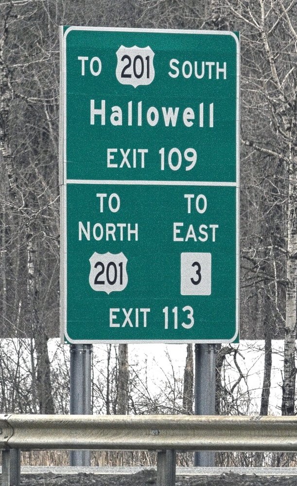 Signs such as these, which direct drivers to smaller cities and towns, would be taken down under a proposal.